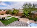 Enjoy outdoor living in this backyard with a patio, low-maintenance landscape, and mountain views at 16551 W Winston Dr, Goodyear, AZ 85338