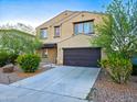 Beautiful home with a two-car garage and desert landscaping at 19954 W Moonlight Path, Buckeye, AZ 85326