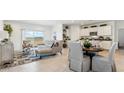 Bright and open floor plan showcases modern finishes and a seamless flow to the kitchen at 38100 W Bello Ln, Maricopa, AZ 85138