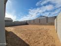 Large, private backyard with block fencing and potential for landscaping and outdoor living at 4167 W Lisa Ln, San Tan Valley, AZ 85144