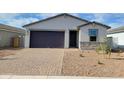 Charming single-story home featuring a two-car garage and low-maintenance landscaping in front at 4167 W Lisa Ln, San Tan Valley, AZ 85144