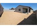 Expansive backyard space with block fencing, offering privacy and potential for outdoor activities at 4211 W Lisa Ln, San Tan Valley, AZ 85144