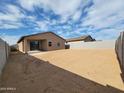 Large backyard featuring a covered patio area, perfect for outdoor entertaining and relaxation at 4212 W Lisa Ln, San Tan Valley, AZ 85144