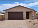 Inviting single-story home with a two-car garage, neutral color palette, and manicured front yard at 4212 W Lisa Ln, San Tan Valley, AZ 85144