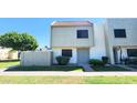 Exterior view of a two story townhouse with a low maintenance yard and gray colored front door at 4752 W Palo Verde Dr, Glendale, AZ 85301