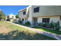 Exterior view of a two story townhouses with low maintenance yards and covered entryways at 4752 W Palo Verde Dr, Glendale, AZ 85301