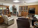 Inviting living room with brick fireplace, built-in shelving, and comfortable seating for relaxing and entertaining at 6637 E Culver St, Scottsdale, AZ 85257