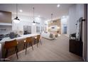 Expansive living space featuring open floor plan, modern lighting, and stylish, cohesive design elements at 802 N Lisbon Dr, Chandler, AZ 85226