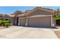 Lovely home featuring an attached two-car garage and a spacious concrete driveway at 927 S Ash St, Gilbert, AZ 85233