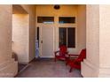 Inviting front entrance with cozy red Adirondack chairs, perfect for enjoying outdoor living at 1022 S Butte Ln, Gilbert, AZ 85296
