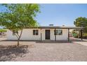 Charming single-story home with a well maintained yard, covered entry, and convenient covered parking at 10693 N Arapaho Dr, Casa Grande, AZ 85122