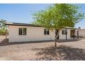 Single-story home featuring a gravel yard, covered entry, and convenient covered parking at 10693 N Arapaho Dr, Casa Grande, AZ 85122