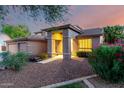 Exterior view of front entrance with desert landscaping and inviting walkway at 20432 N 87Th Dr, Peoria, AZ 85382