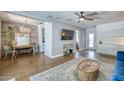 Open living space with exposed brick wall, modern furnishings, and access to backyard at 2335 W Campus Dr, Phoenix, AZ 85015