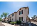 A well-maintained two-story home with shutters, lush landscaping, and a welcoming facade at 2668 N 73Rd Gln, Phoenix, AZ 85035