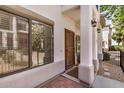 Welcoming entrance features brick-paved walkway, decorative columns, and a stylish front door at 3150 E Beardsley Rd # 1091, Phoenix, AZ 85050