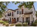 Inviting townhouse showcases private balconies, gated patios, and manicured landscaping at 3150 E Beardsley Rd # 1091, Phoenix, AZ 85050