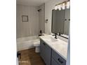 Bright bathroom featuring updated fixtures, sleek vanity, bathtub, and modern tile work in shower at 3517 E Blanche Dr, Phoenix, AZ 85032