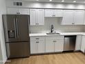This is a beautiful kitchen with stainless steel appliances, white countertops, and plenty of storage space at 3517 E Blanche Dr, Phoenix, AZ 85032