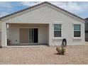 Back patio and gravel landscaping offer a blank canvas for your backyard dreams at 4032 N 308Th Dr, Buckeye, AZ 85396