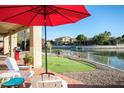 Outdoor patio with putting green and waterfront views are perfect for entertaining and enjoying the outdoors at 5281 W Quail Ave, Glendale, AZ 85308