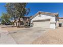 Single-story home with a two-car garage and desert landscaping for easy upkeep at 5635 S 11Th Dr, Phoenix, AZ 85041