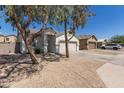 View of home's front elevation, xeriscaped yard, and well-maintained surroundings at 5635 S 11Th Dr, Phoenix, AZ 85041