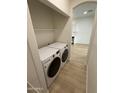 Convenient laundry area with modern washer and dryer, offering functionality and efficiency at 5635 S 11Th Dr, Phoenix, AZ 85041