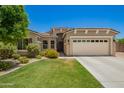 Charming single-Gathering home featuring a well-maintained lawn and two-car garage in a desirable neighborhood at 5735 S Cloverdale Ln, Gilbert, AZ 85298