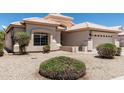 Charming single story home with a two car garage and a well kept xeriscaped front yard at 14672 W Whitton Ave # 0, Goodyear, AZ 85395