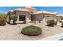 Charming single story home with a two car garage and a well kept xeriscaped front yard at 14672 W Whitton Ave # 0, Goodyear, AZ 85395