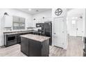 Modern kitchen featuring granite countertops, stainless steel appliances, and a center island at 15515 N 165Th Ave, Surprise, AZ 85388