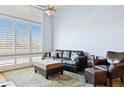 Light and bright living area with plantation shutters and comfortable seating arrangement at 1701 E Colter St # 443, Phoenix, AZ 85016