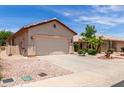 Beautiful single-story home with desert landscaping, a driveway, and a two-car garage at 22508 W Antelope Trl, Buckeye, AZ 85326