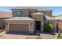 Well-maintained two story house with beautiful landscaping, tile roof, and tan exterior paint at 2321 W Brookhart Way, Phoenix, AZ 85085