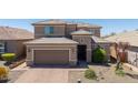 Aerial view of the exterior, displaying desert landscaping and a large tile roof at 2321 W Brookhart Way, Phoenix, AZ 85085