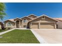 Charming two-story home boasts a three car garage, manicured lawn, and neutral color palette at 2723 N Winthrop --, Mesa, AZ 85213