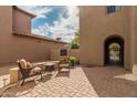 Tranquil courtyard featuring brick pavers and comfortable seating, ideal for enjoying sunny afternoons at 3964 E Hummingbird Ln, Phoenix, AZ 85050