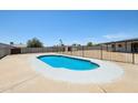 Refreshing backyard pool with secure fencing, a concrete surround, and ample space for outdoor relaxation and entertainment at 4117 W Camino Acequia Ave, Phoenix, AZ 85051