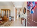 Bright foyer with tile flooring and stylish decor that leads into an open floor plan at 4553 W Kirkland Ave, San Tan Valley, AZ 85144