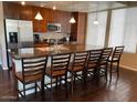 Bright, open kitchen featuring modern stainless steel appliances, granite countertops, and a breakfast bar with seating at 6605 N 93Rd Ave # 1071, Glendale, AZ 85305