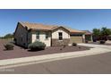 Attractive home featuring desert landscaping, a tile roof, and a two car garage at 6713 S 76Th Dr, Laveen, AZ 85339