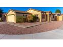 Single-story home with a two car garage, desert landscaping, and a tile roof at 7317 S 37Th Gln, Phoenix, AZ 85041