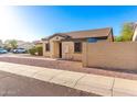 Single-story home featuring desert landscaping and a block wall for added privacy at 7317 S 37Th Gln, Phoenix, AZ 85041