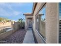 Charming home entrance featuring a security door and decorative metal art on the window at 7405 W Elwood St, Phoenix, AZ 85043