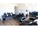 Spacious living room with modern furnishings and sleek hardwood flooring, perfect for entertaining at 9625 W Mountain View Rd # B, Peoria, AZ 85345