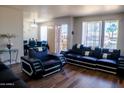 Open-concept living space showcasing modern decor, hardwood floors, and natural light creating an inviting atmosphere at 9625 W Mountain View Rd # B, Peoria, AZ 85345