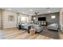 Inviting living room featuring contemporary furniture, a ceiling fan, and a neutral color scheme at 12712 W Corona Ave, Avondale, AZ 85323