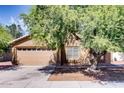 Charming single-Gathering home featuring a two-car garage and mature landscaping in a residential neighborhood at 2822 N 90Th Ave, Phoenix, AZ 85037