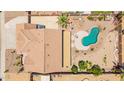 An aerial view of a home highlighting the backyard pool and lush landscaping at 31453 N Blackfoot Dr, San Tan Valley, AZ 85143